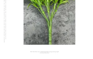 Detailed close-up of realistic green artificial plant stems and textured leaf joints