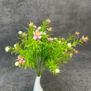 Artificial pink and white flowers in a minimalist white ceramic vase for home decor