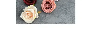 Detail of premium matte fabric rose heads in burgundy, champagne and dusty pink