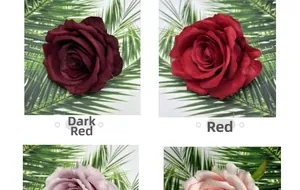 Detail of matte fabric rose heads in dark red and vibrant red for wedding decor