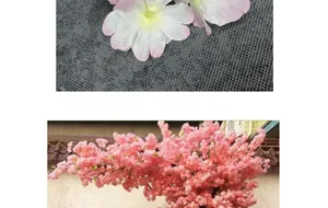 Close-up of artificial cherry blossoms with silk petals in light pink for wall decoration