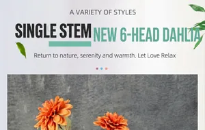 Détail d'un dahlia artificiel à tige unique avec 6 têtes de fleurs orange et feuilles vertes