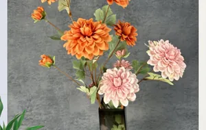 Macro detail of artificial dahlia petals in deep orange and pink purple with realistic texture