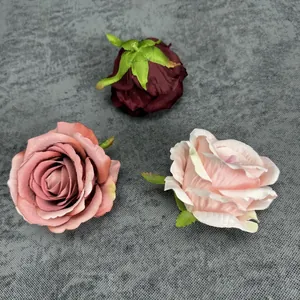 Artificial fabric rose heads in dark red and pink for wedding backdrop decoration