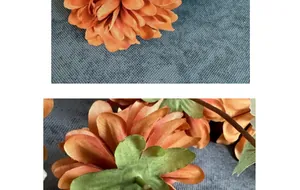 Detailed macro view of orange silk dahlia petals and green calyx texture