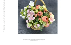 Close-up of pink and coral artificial flowers in a rustic woven basket for home decor