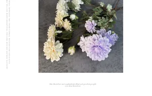 Detailed view of 6-head artificial dahlia flowers in purple and cream for wedding decor