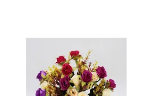 Detailed view of artificial silk roses with vibrant petals and realistic green leaves