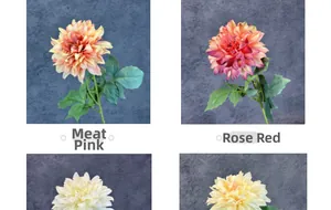 Detail view of artificial dahlia petals in nude pink and rose red with realistic green leaves