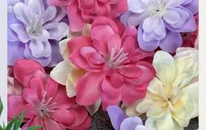 Close-up of silk violet and larkspur flower heads for DIY crafts and wedding decor