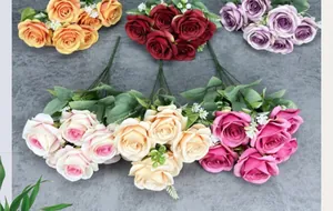 Detailed overhead view of six artificial rose bouquets in various colors on a grey background