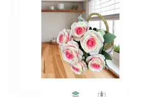Detail of pink artificial rose bouquet in a woven wicker basket on a kitchen counter
