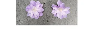 Detailed top view of silk artificial violet flower heads with gradient purple petals
