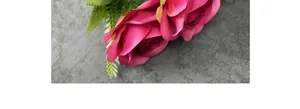 Close-up of artificial 7-head silk rose bouquet in deep pink for wedding home decor