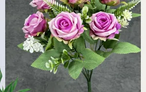 Detailed close-up of realistic purple-pink silk roses with lush green leaves and white buds