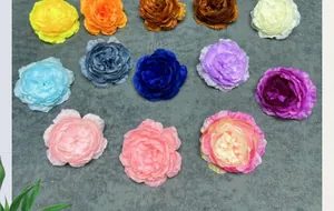 Top view of multi-colored silk peony flower heads with realistic layered petals
