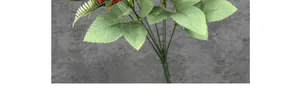 Close-up of realistic red silk rose petals and green serrated leaves for home decor