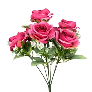 7-head faux rose bouquet in deep pink with silk petals and green leaves on white background