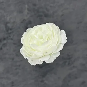 Realistic white silk peony flower decoration with multi-layered petals on grey background