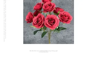 Macro shot of 9-head bouquet of deep red artificial roses with velvet leaf detail