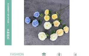 Detailed view of artificial silk ranunculus flowers in light blue, white and yellow