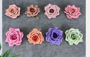Flat lay view of assorted artificial silk rose heads in eight elegant vintage colors