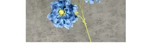Detailed close-up of realistic blue silk peony flower with green leaves and yellow center