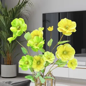 Detail of yellow artificial butterfly flowers with realistic petals for home decor