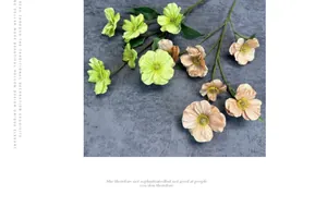 Detailed macro view of artificial silk butterfly flowers in soft pink and light green