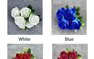 Detailed view of artificial velvet roses in white and blue for wedding floral arrangements