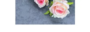 Detailed view of pink and white gradient silk roses with realistic green leaf textures