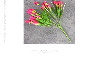 Close-up of artificial deep pink tulip buds with realistic green foliage for home decor