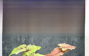 Detail of single artificial plant stem with 11 realistic pink and green spring grass leaves