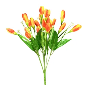 Vibrant orange tulip bouquet with green leaves and small white flowers on white background
