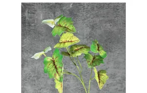 Detailed view of artificial green taro leaves with realistic brown veins for home decor
