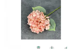 Detailed view of pink silk hydrangea with realistic green leaves and stem for home decor