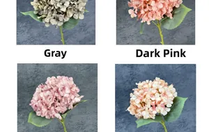 Detail of faux hydrangeas in grey, dark pink, pink and champagne for wedding decor