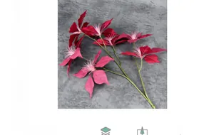 Macro detail of artificial poinsettia petals with deep red gradient and realistic stamens