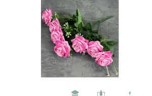 Detail of 7-head pink velvet artificial roses with green leaves and small white accents