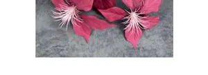 Close-up of magenta artificial Poinsettia flower with silk petals and feather stamens