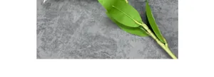 Detailed view of lifelike green artificial lily leaves with natural vein textures