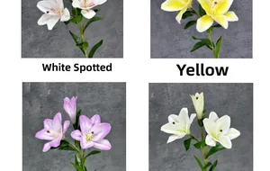 Detail view of 3D lifelike lily flowers in white, yellow, purple, and cream colors