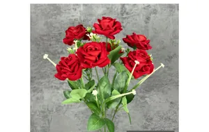 Detailed close-up of premium red silk rose petals and green foliage for wedding decor