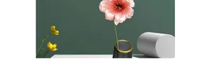 Close-up of pink artificial gardenia with rich petals in a grey matte vase