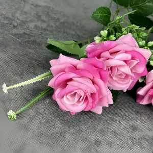Pink velvet artificial roses with seven heads for home and wedding decor in soft focus