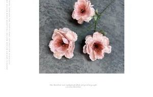 Detailed close-up of a pink faux gardenia with three blooming flower heads and green leaves