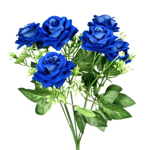 Artificial bouquet of seven blue velvet roses with green leaves for home wedding decor