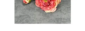 Detailed macro view of vintage artificial peony with gradient petals and silk texture