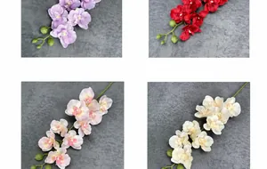 Detailansicht künstlicher Orchideen aus Seide in Hellviolett, Rot, Rosa und Cremeweiß