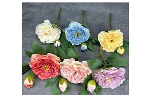 Detailed view of six artificial peonies in various colors with green leaves and buds